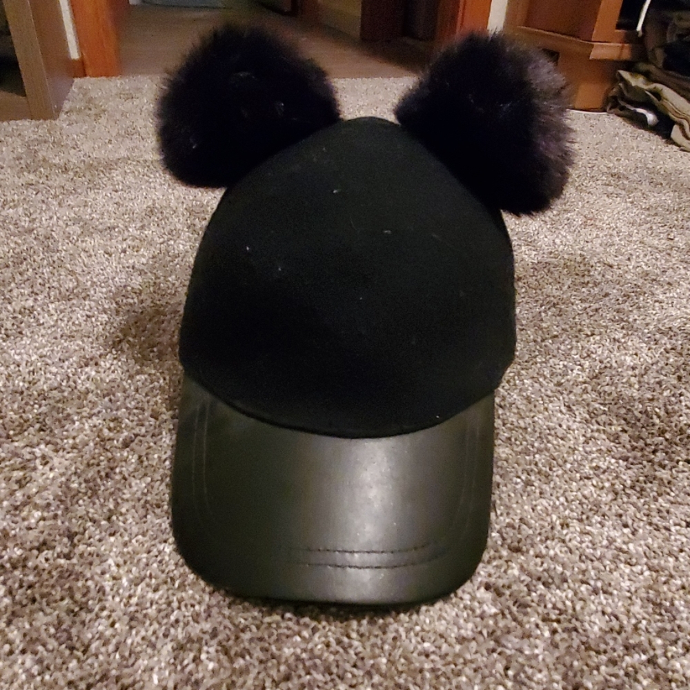 Black hat with pompoms